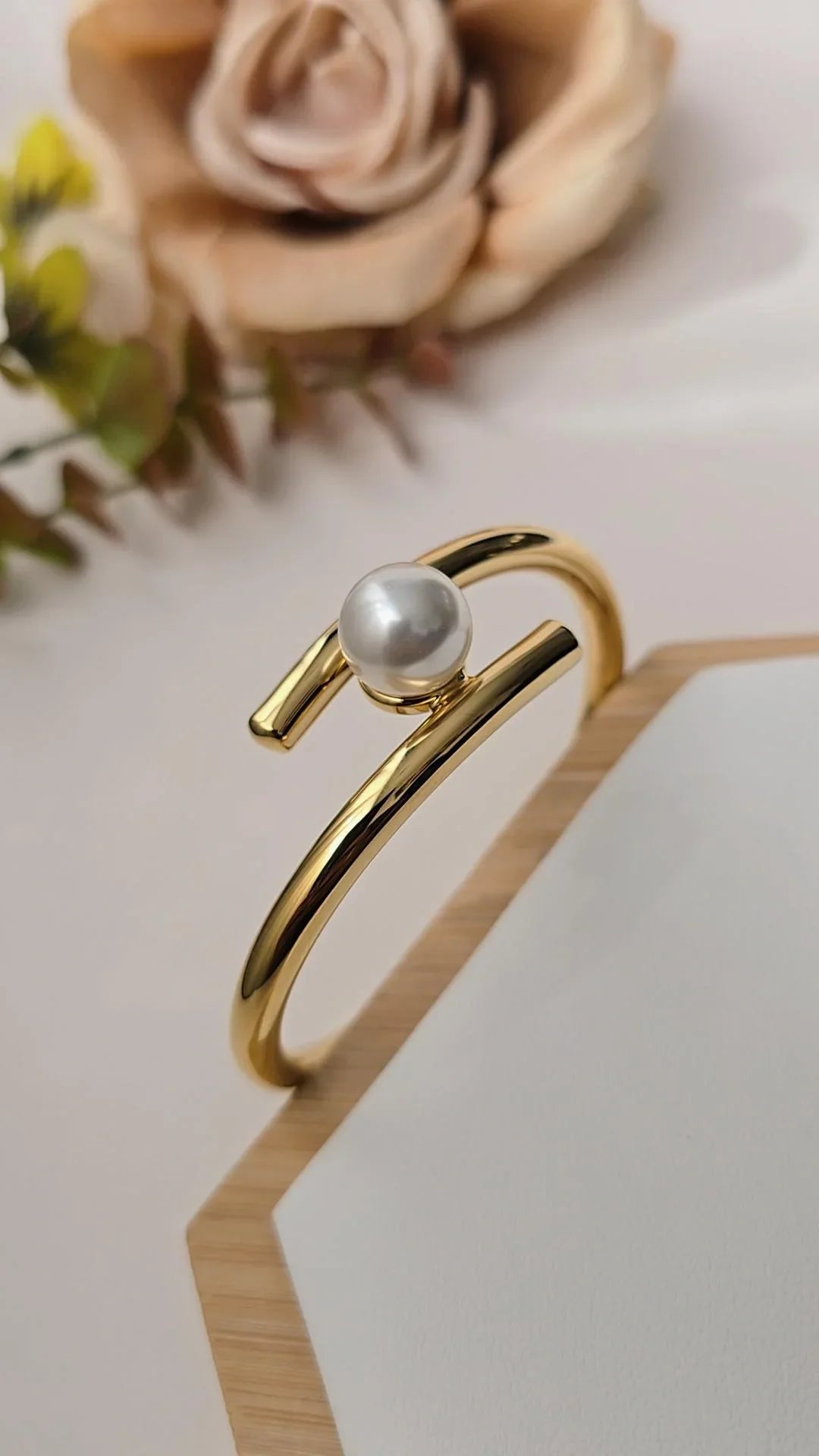 Gold bracelet with single pearl detail from Blissbymi, displayed on a neutral background.