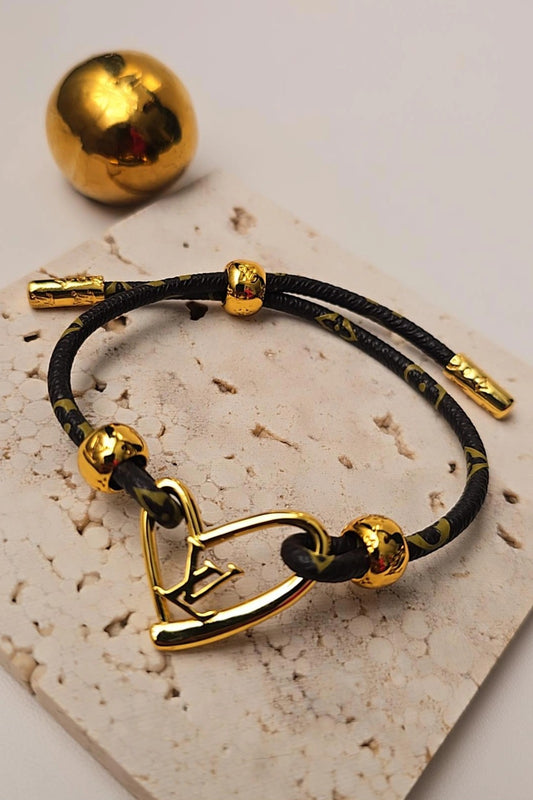 Gold bracelet with heart charm