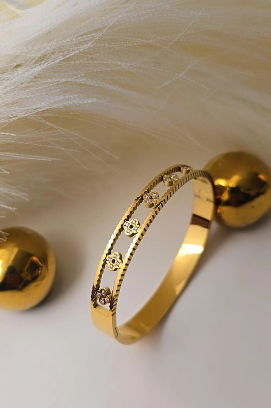 Gold bracelet with intricate design
