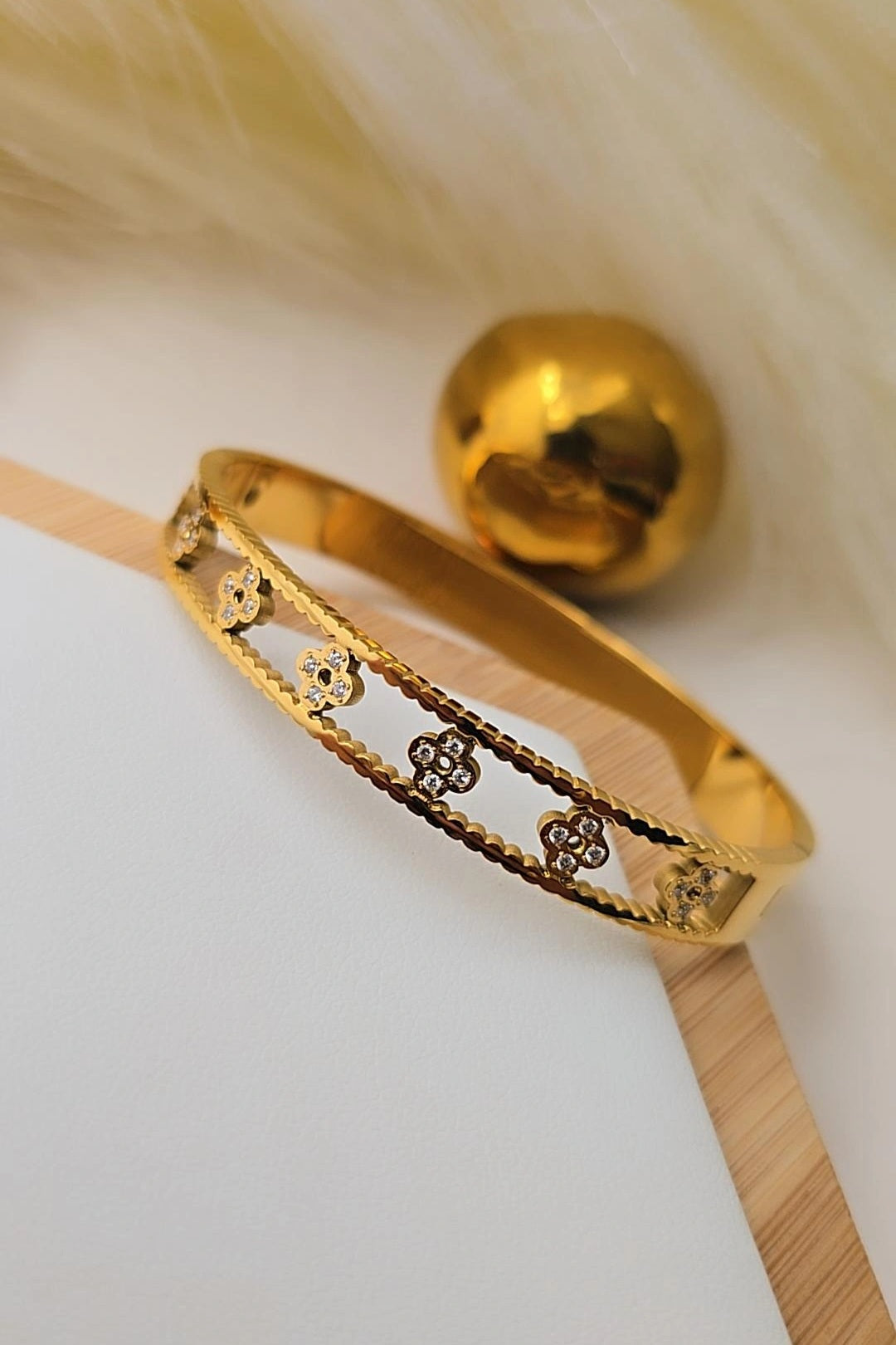 Gold bracelet with intricate designs