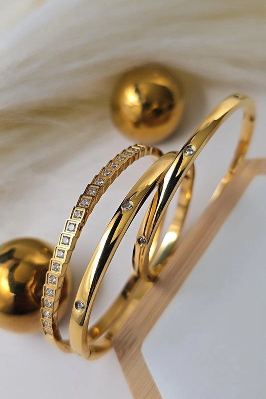 Gold bangles with diamond accents