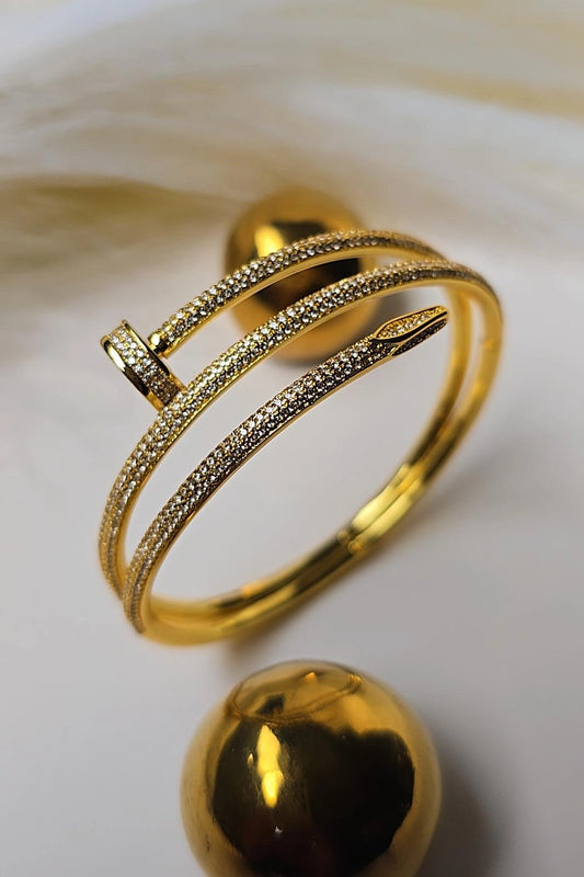 Gold bracelet with intricate design 